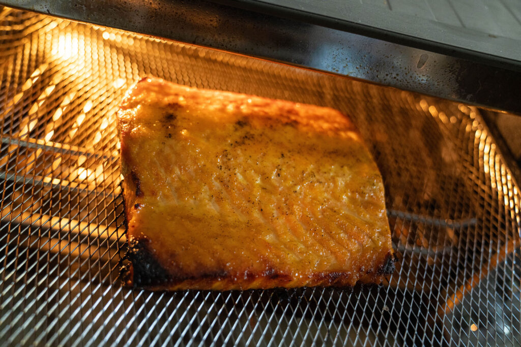 Air fried salmon on a rack in the air fryer