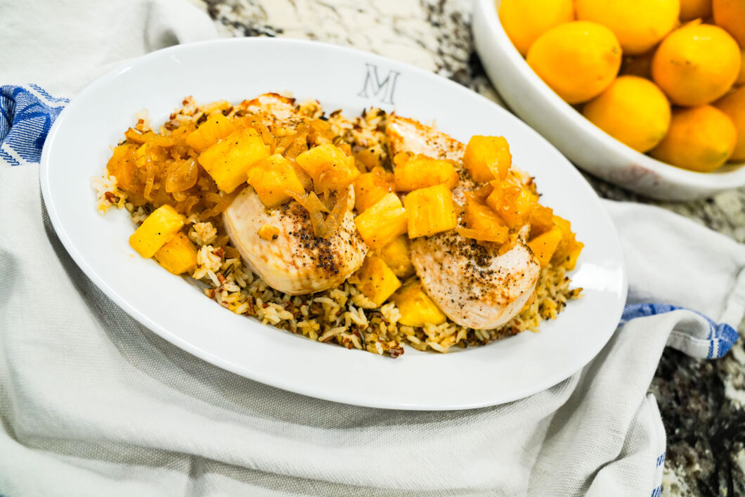 Grilled chicken with pineapple and caramelized onion sauce served over wild rice