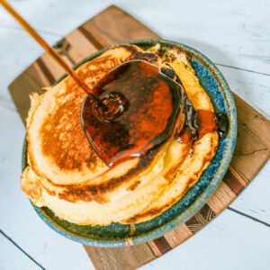 Browned Butter Pancakes with syrup on breakfast plate