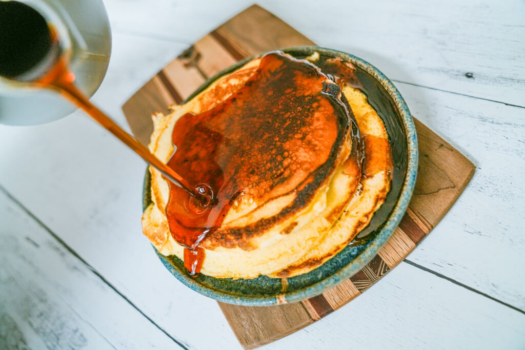 stack of pancakes with fresh syrup